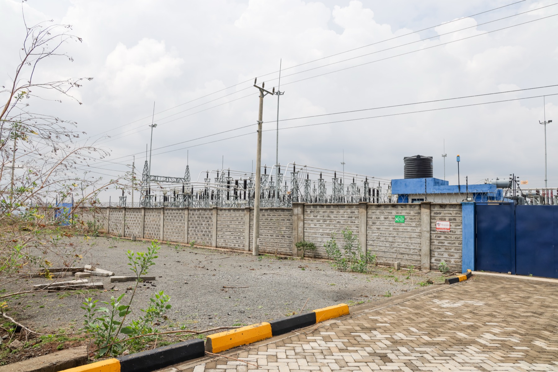The 90 MVA substation serving Hells Gate, Naivasha SEZ — open-air switchyard, perimeter wall, dual transmission feed